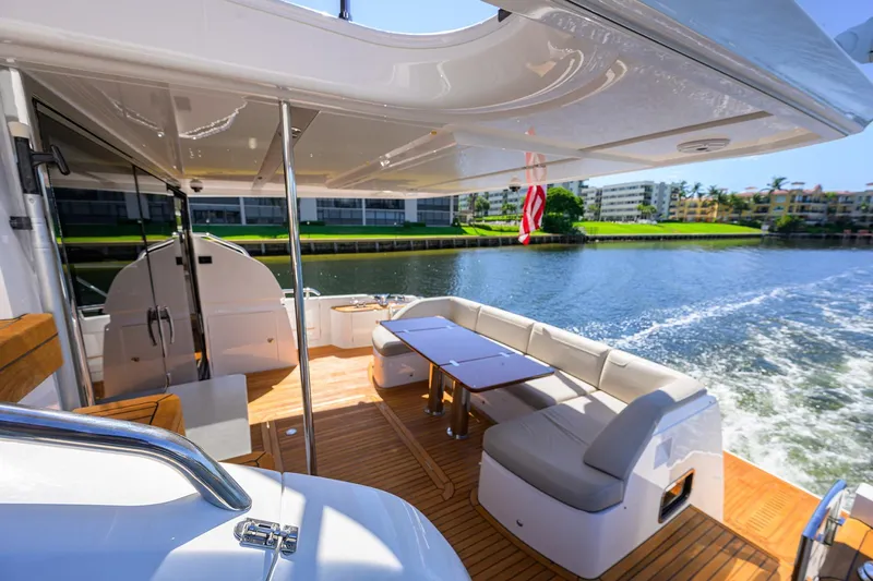 Slide: The Image of Luxurious 2020 Princess F70 yacht interior with elegant seating and scenic water view. - 76
