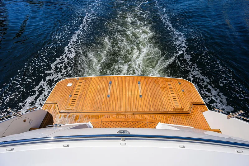 Slide: The Image of Rear view of 2020 Princess F70 yacht with teak deck and ocean wake. - 80