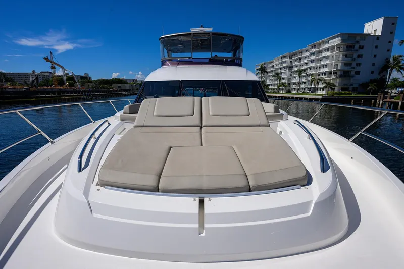 Slide: The Image of 2020 Princess F70 yacht with sunbathing deck, docked near waterfront buildings. - 89