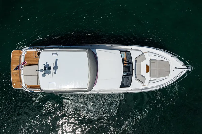 Slide: The Image of Aerial view of 2020 Princess F70 yacht on water, showcasing sleek design and spacious deck. - 9