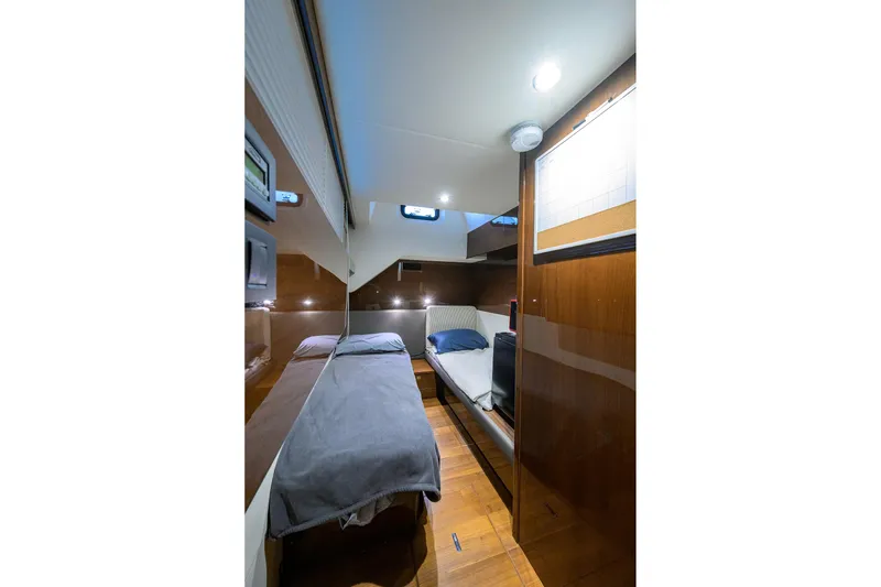Slide: The Image of Luxurious cabin interior of 2020 Princess F70 yacht with modern design and cozy bedding. - 92