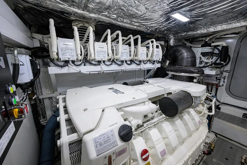 Slide: The Image of Engine room of a 2020 Princess F70 yacht, showcasing advanced machinery and equipment. - 98
