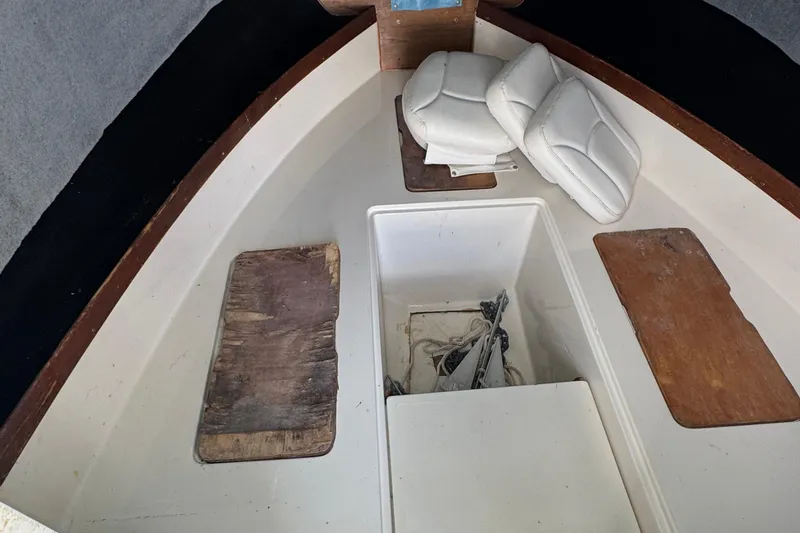 Slide: The Image of Interior of 1984 Grady-White Offshore 24 boat with storage compartments and cushions. - 12