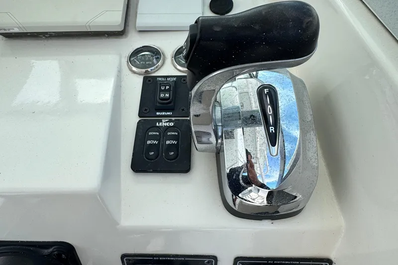 Slide: The Image of Throttle controls on a 1984 Grady-White Offshore 24 boat dashboard. - 14