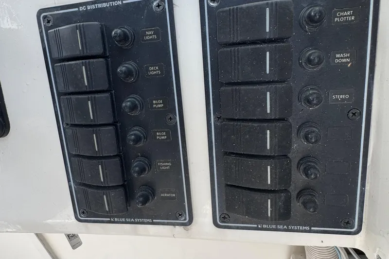 Slide: The Image of Control panel of a 1984 Grady-White Offshore 24 boat with labeled switches. - 15