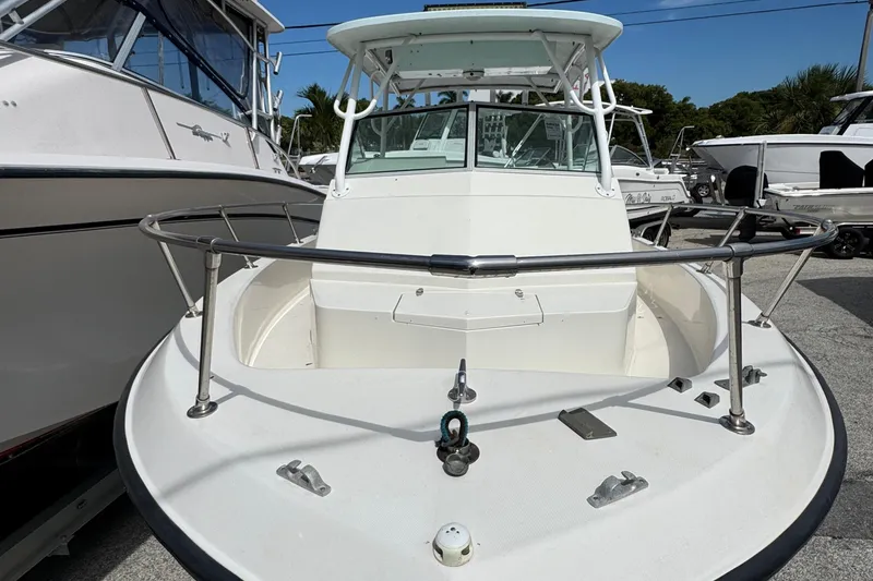 Slide: The Image of 1984 Grady-White Offshore 24 boat with white hull and stainless steel railings. - 8