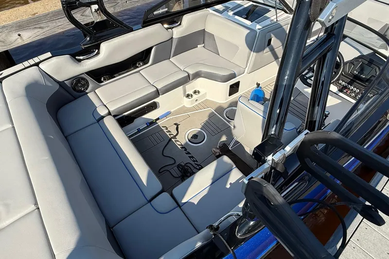 Slide: The Image of 2019 Moomba Helix boat interior with gray seating and modern design. - 3