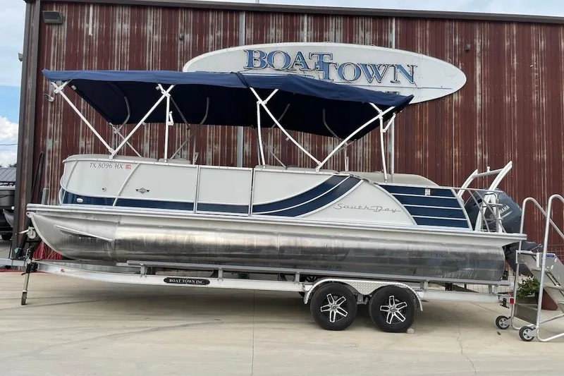 The Image of 2020 South Bay 523 pontoon boat with blue canopy at Boat Town dealership. - 0