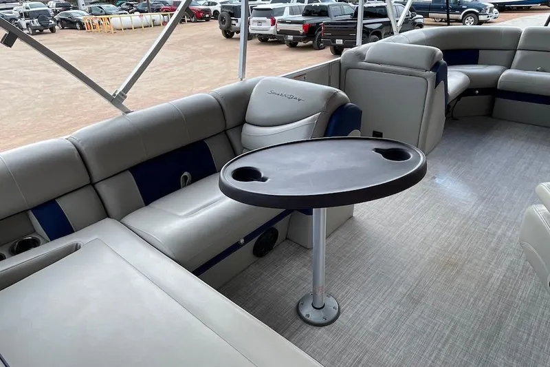 Slide: The Image of 2020 South Bay 523 pontoon boat interior with seating and table. - 6