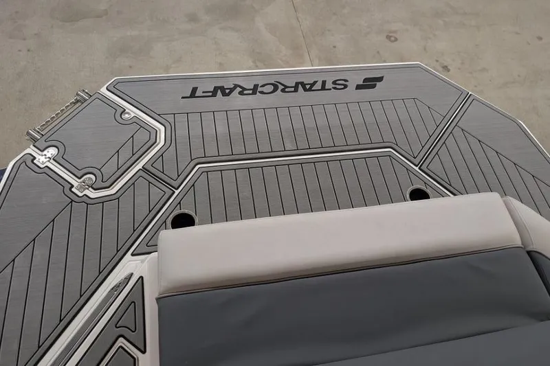 Slide: The Image of 2025 Starcraft SVX 210 IO boat deck with sleek gray design and logo. - 12