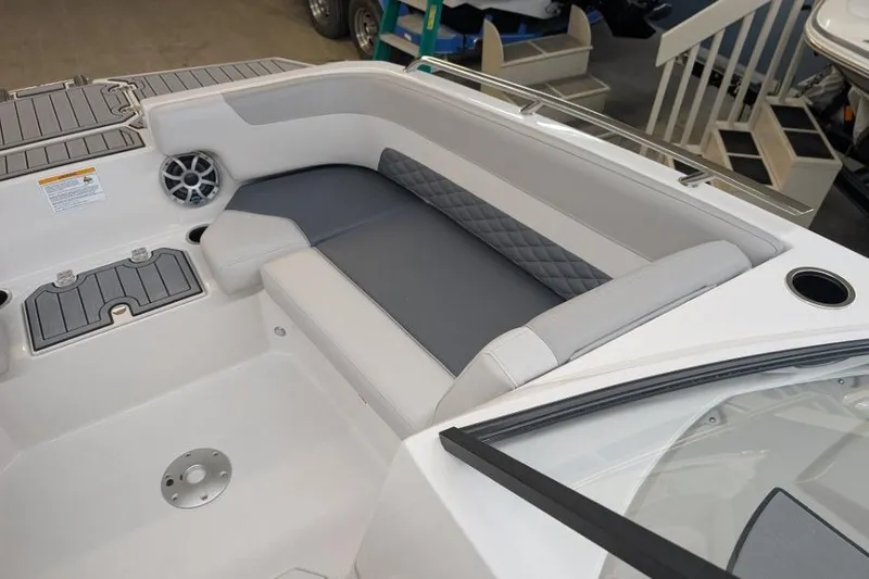 Slide: The Image of Interior of 2025 Starcraft SVX 210 IO boat with gray seating and speaker. - 4