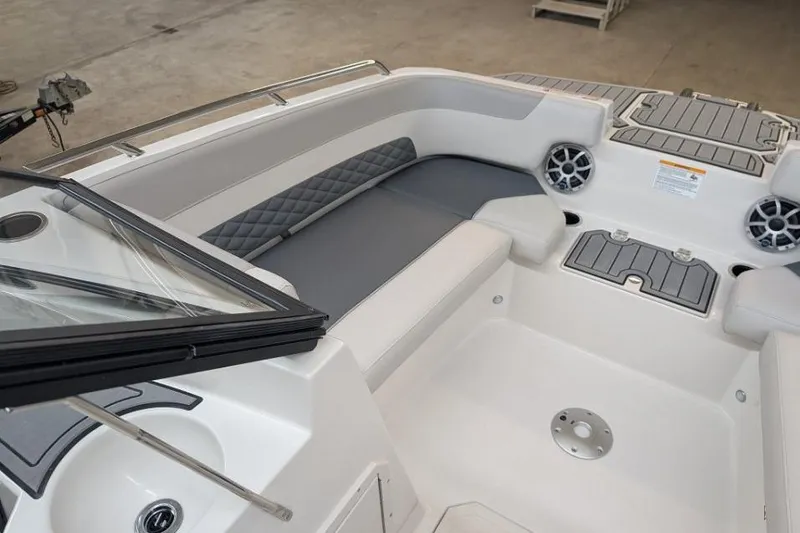 Slide: The Image of 2025 Starcraft SVX 210 IO boat interior with gray seating and modern design features. - 5