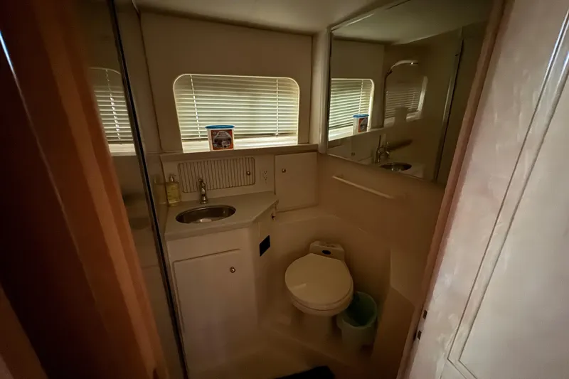 Slide: The Image of Bathroom interior of 1998 Carver 356 Aft Cabin yacht with sink and toilet. - 15