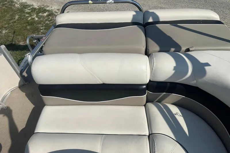 Slide: The Image of 2005 Harris Classic 260 boat seating with beige and black upholstery. - 10
