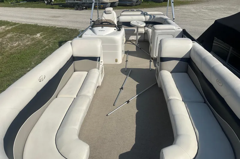 Slide: The Image of 2005 Harris Classic 260 pontoon boat with spacious seating and steering console. - 3
