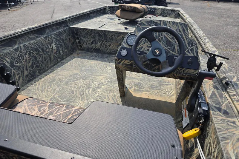 Slide: The Image of 2014 Ranger 1862 MPV boat interior with camouflage design and steering console. - 8