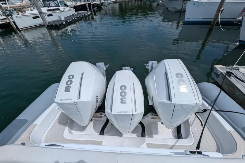 Slide: The Image of 2015 Yellowfin RIB with triple Mercury 300 engines docked at marina. - 11