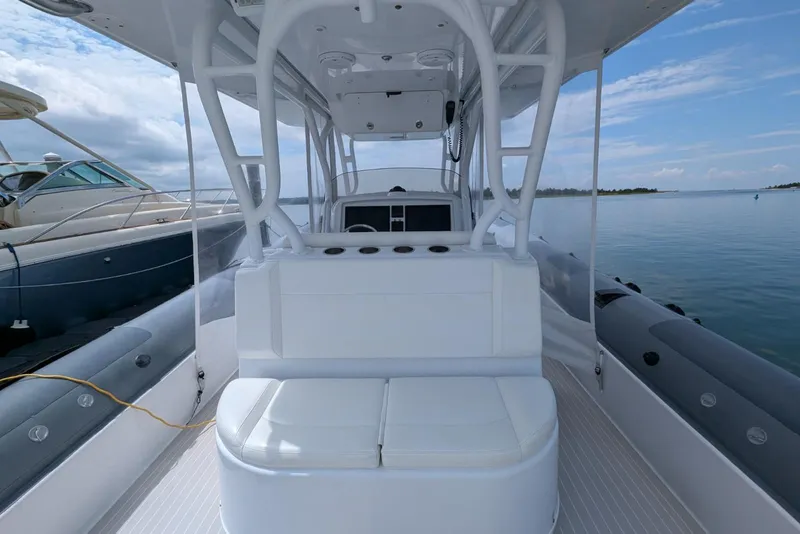 Slide: The Image of 2015 Yellowfin RIB boat interior with white seating and ocean view. - 12