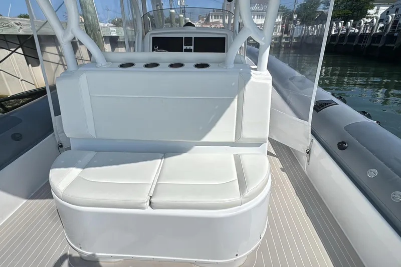 Slide: The Image of 2015 Yellowfin RIB boat interior with white seating and rod holders. - 14