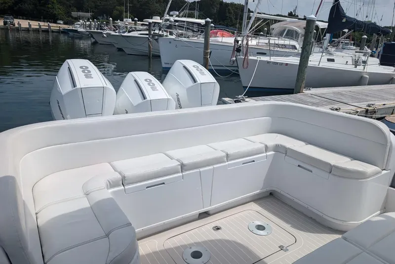 Slide: The Image of 2015 Yellowfin RIB boat with triple outboard engines docked at marina. - 18