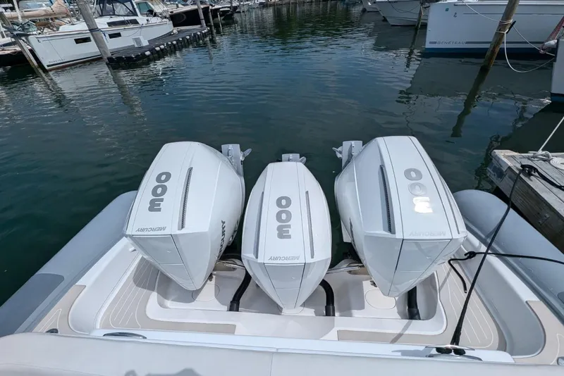 Slide: The Image of 2015 Yellowfin RIB with triple Mercury 300 engines docked at marina. - 21
