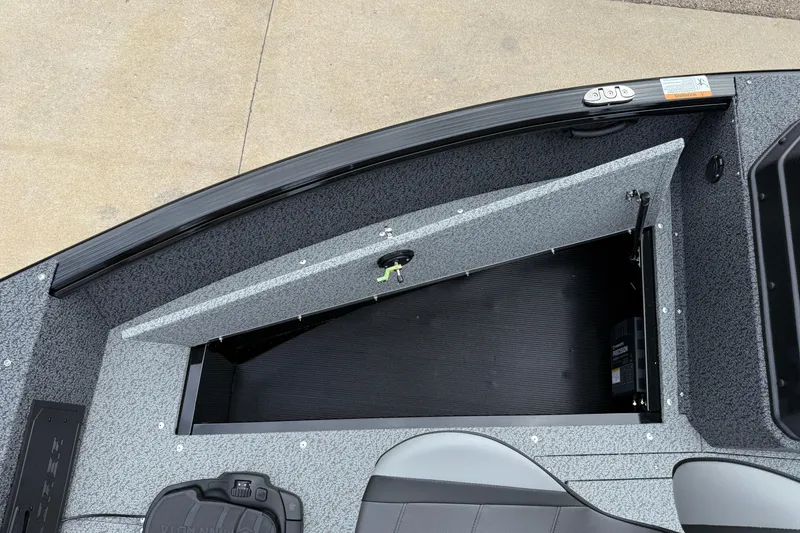 Slide: The Image of 2026 Lund 1800 Explorer Sport boat interior with open storage compartment. - 11