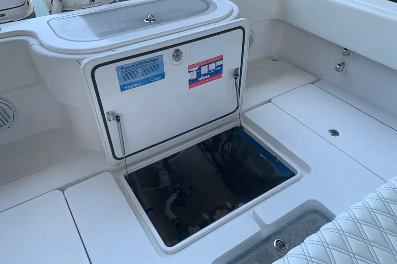 Slide: The Image of Open hatch on 2008 Invincible 36 CC boat deck, revealing storage compartment. - 10