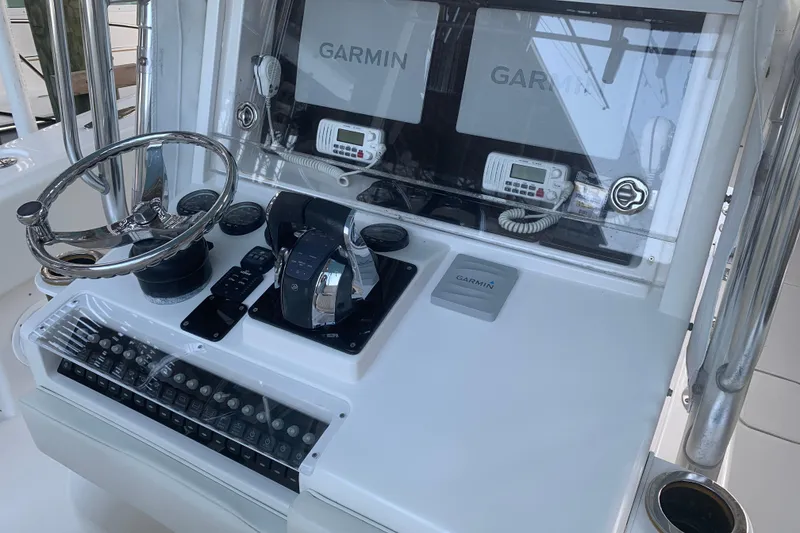 Slide: The Image of Control panel of 2008 Invincible 36 CC boat with Garmin navigation systems. - 12