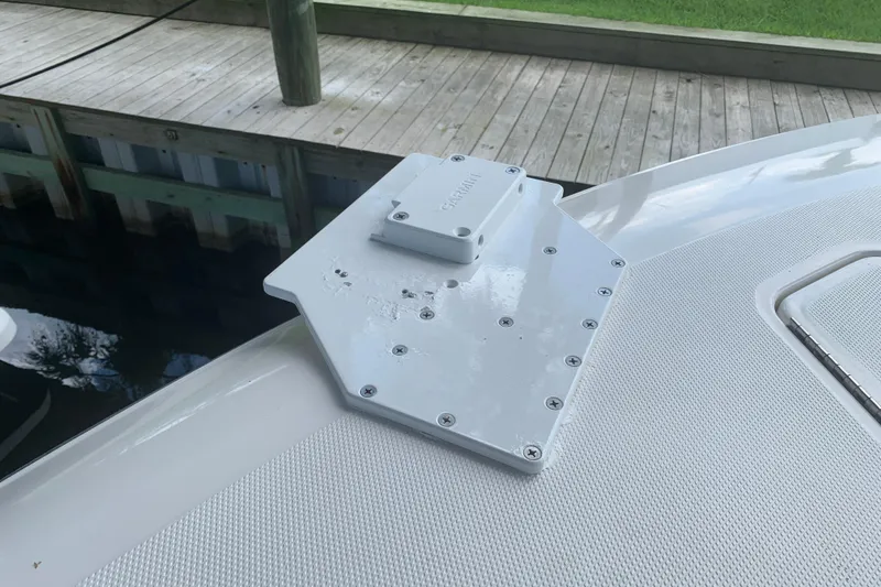 Slide: The Image of Invincible 36 CC 2008 boat deck with mounted equipment near dock. - 18