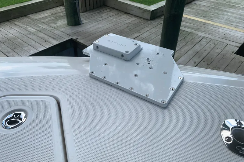 Slide: The Image of Invincible 36 CC 2008 boat deck with mounted Garmin bracket, dockside view. - 19