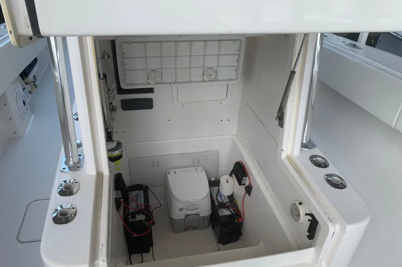 Slide: The Image of 2008 Invincible 36 CC boat storage compartment with batteries and equipment. - 20