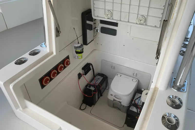 Slide: The Image of Interior of 2008 Invincible 36 CC boat showing equipment and compact toilet. - 21