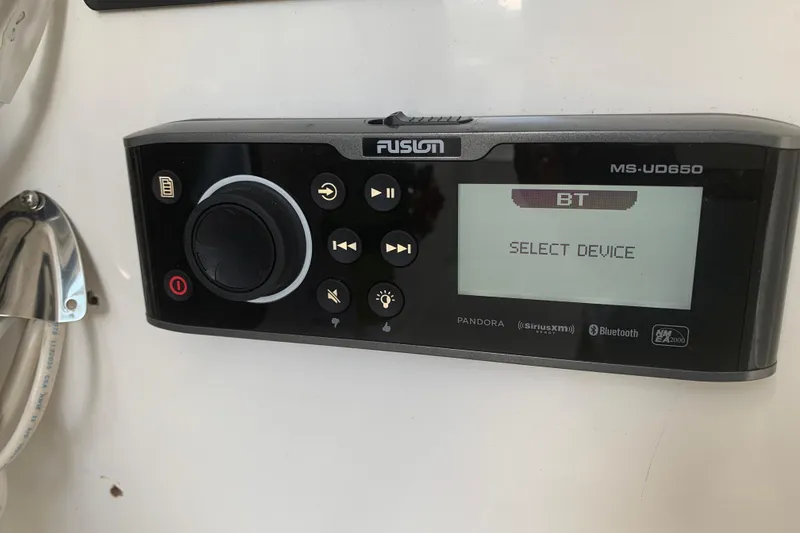 Slide: The Image of Fusion MS-UD650 stereo system on 2008 Invincible 36 CC boat, displaying "Select Device." - 23