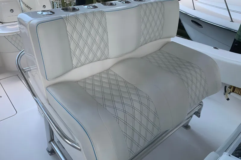 Slide: The Image of Luxurious seating on 2008 Invincible 36 CC boat with diamond-stitched upholstery. - 26
