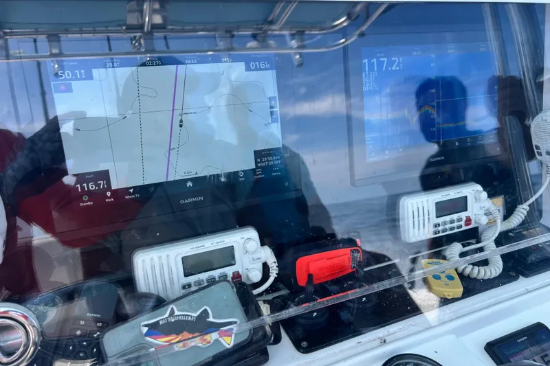 Slide: The Image of Control panel of a 2008 Invincible 36 CC boat with Garmin navigation displays. - 41