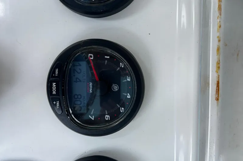 Slide: The Image of Close-up of a 2008 Invincible 36 CC boat tachometer displaying RPM and voltage. - 44