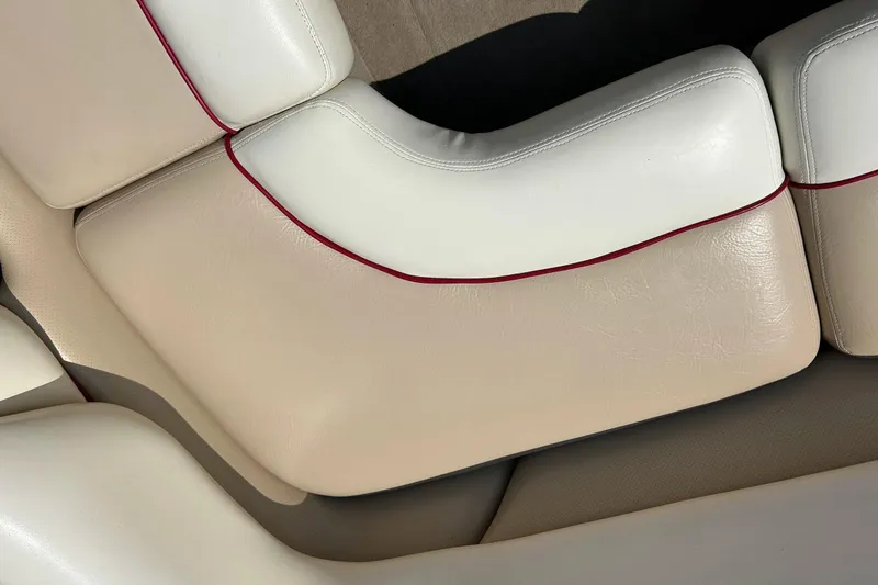 Slide: The Image of 1999 Malibu Sunsetter VLX boat interior with beige and white leather seats. - 21