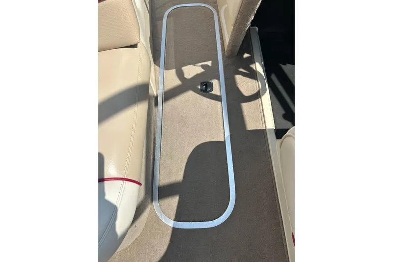 Slide: The Image of 1999 Malibu Sunsetter VLX interior with beige seating and carpeted floor. - 28