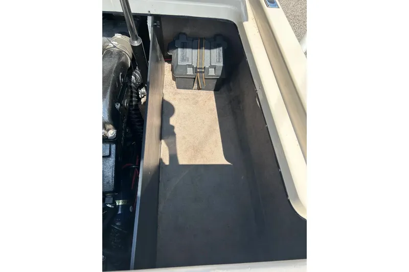 Slide: The Image of 1999 Malibu Sunsetter VLX engine compartment with battery and components visible. - 36