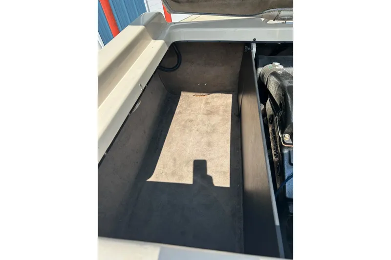 Slide: The Image of 1999 Malibu Sunsetter VLX engine compartment, showcasing interior details and components. - 37