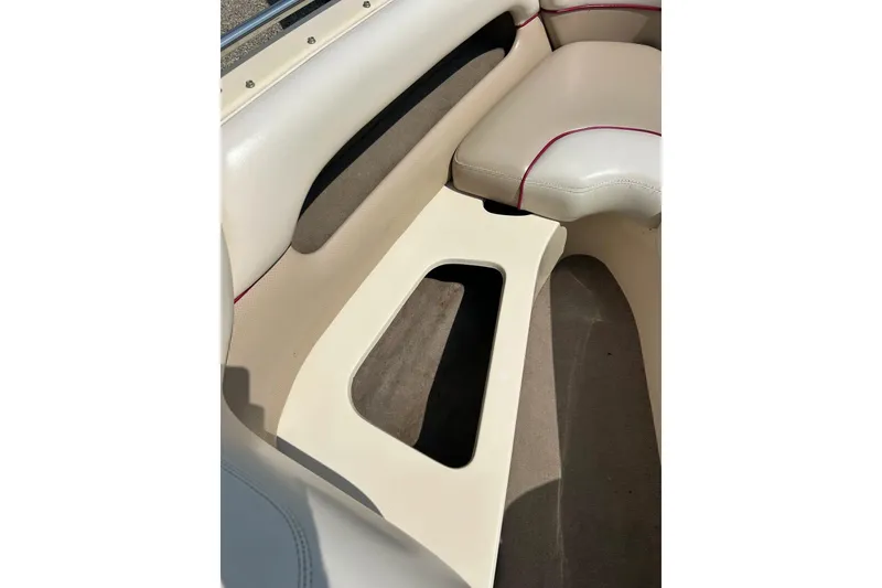 Slide: The Image of 1999 Malibu Sunsetter VLX interior seating with beige and red accents. - 8
