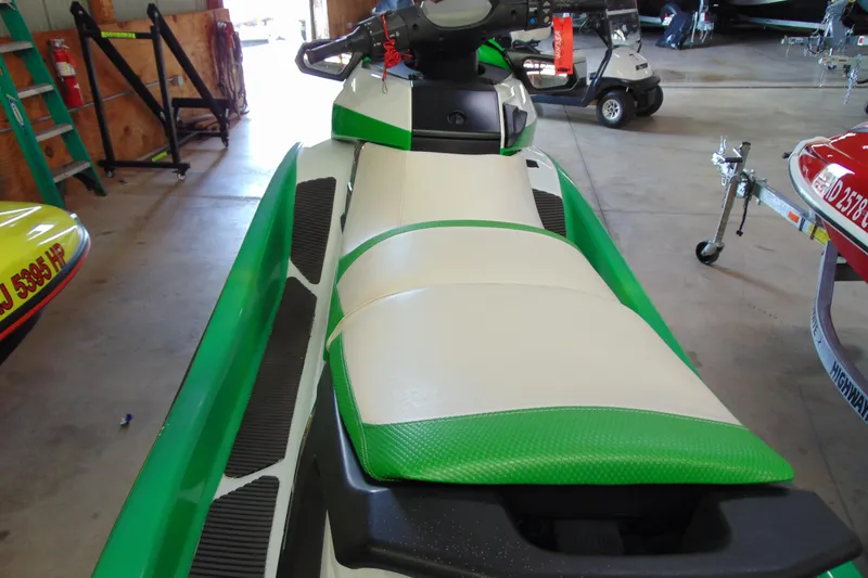 Slide: The Image of 2014 Yamaha WaveRunner FX HO in a garage, featuring green and white seating. - 5