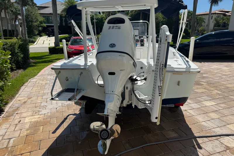 Slide: The Image of 2019 Sea Pro 172 Bay boat with outboard motor on a sunny driveway. - 10