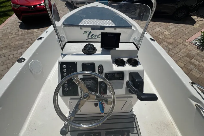 Slide: The Image of 2019 Sea Pro 172 Bay boat console with steering wheel and navigation equipment. - 4