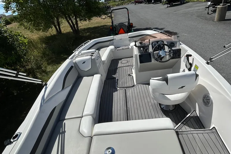 Slide: The Image of 2021 Starcraft SVX 191 OB boat interior with seating and steering console. - 3