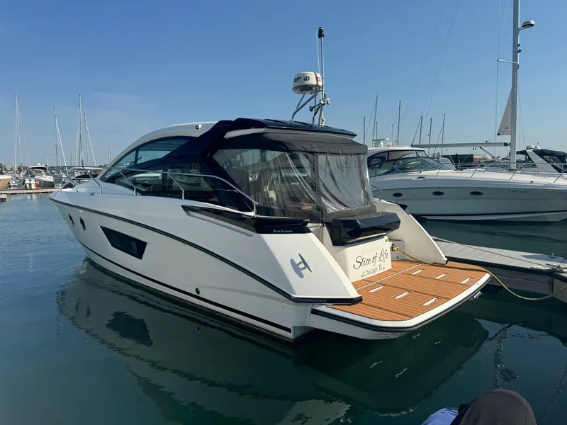 The Image of 2018 Beneteau Gran Turismo 40 yacht docked in marina, rear view. - 0