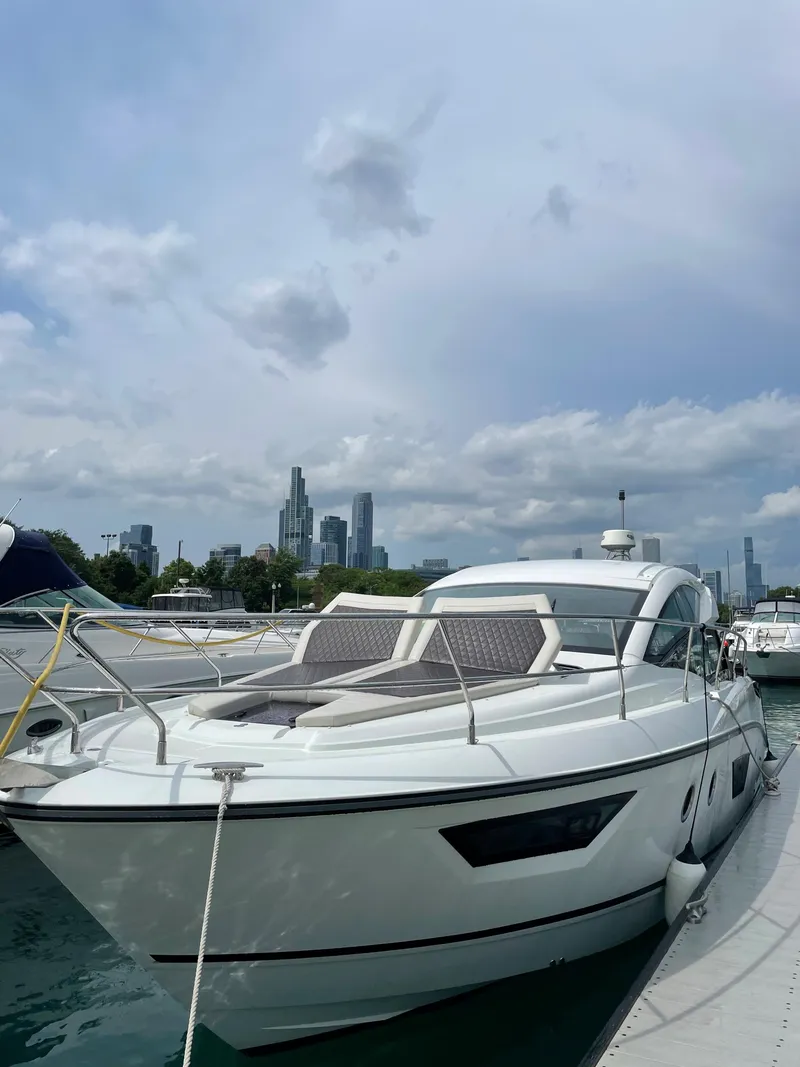 Slide: The Image of 2018 Beneteau Gran Turismo 40 yacht docked with city skyline backdrop. - 14