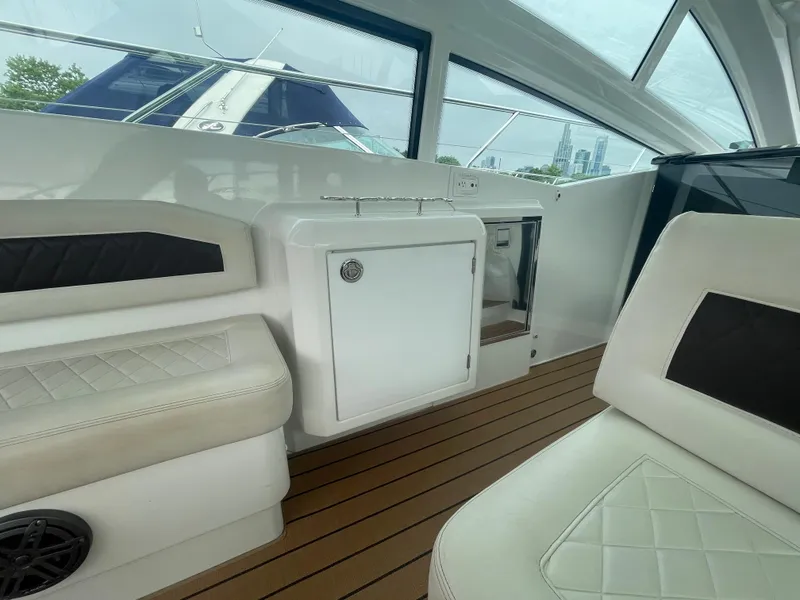 Slide: The Image of Interior of 2018 Beneteau Gran Turismo 40 yacht with white seating and wood flooring. - 18