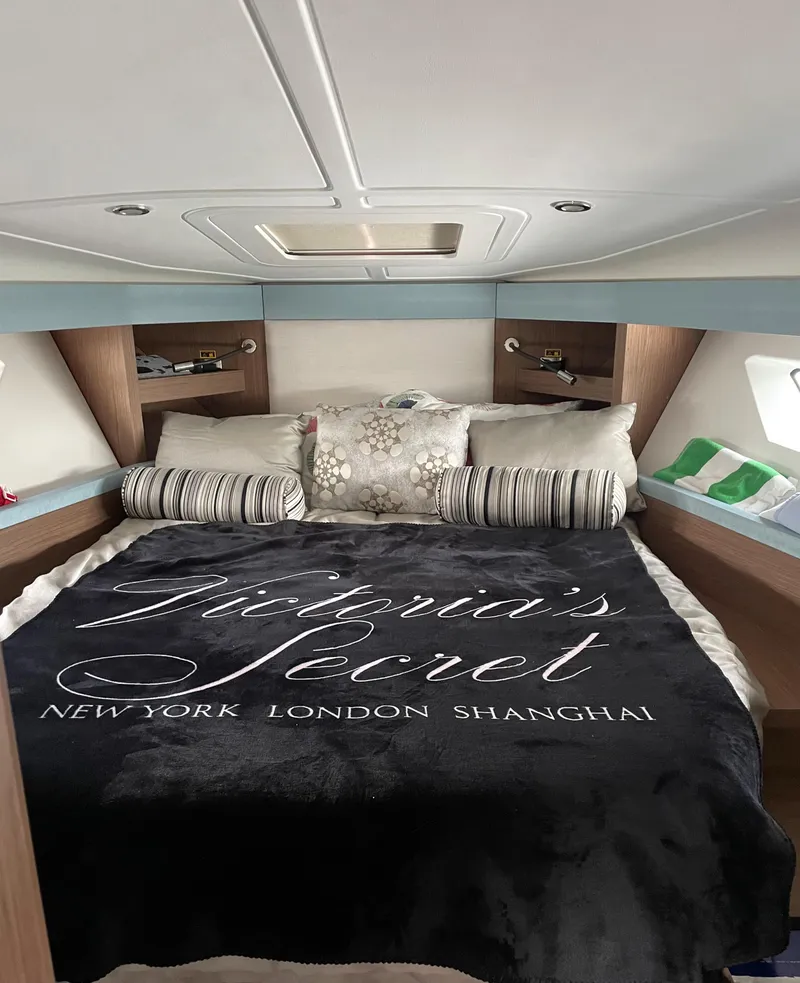 Slide: The Image of Luxurious bedroom in 2018 Beneteau Gran Turismo 40 yacht with Victoria's Secret bedding. - 27