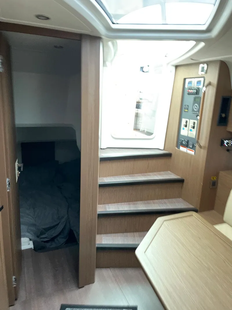 Slide: The Image of Interior of 2018 Beneteau Gran Turismo 40 yacht with wood finish and skylight. - 29